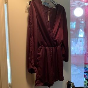 Fancy silk plum romper w interesting arm cuts and a float Vline